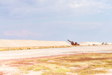People gathering salt of pink salty Siwash Lake, colored by microalgae, famous for antioxidant...