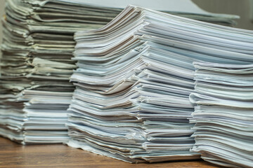 bundles bales of paper documents. stacks packs pile on the desk in the office