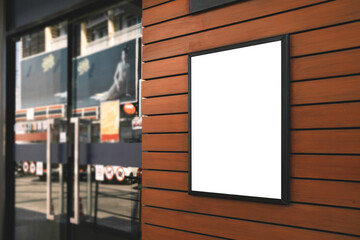 Mockup white poster or white paper promotion  displayed on the front of the restaurant, coffee shop promotion information for marketing announcements and details