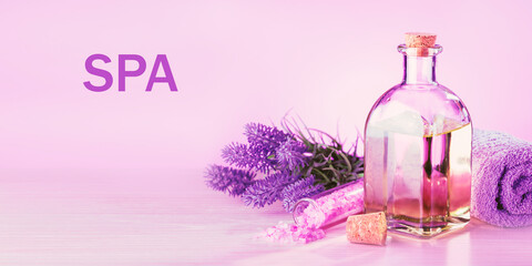 Obraz na płótnie Canvas Spa products with lavender flowers on a pink table.