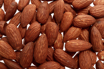 Top view close up group of roasted almonds on white background. Foods concept.
