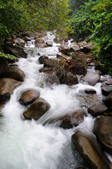 Mountain Water Cascading  Over Rocks