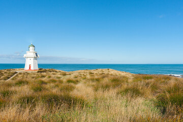 Fototapeta na wymiar Lighthouse and coastal scenery