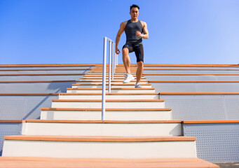 young man running downstairs at  stadium