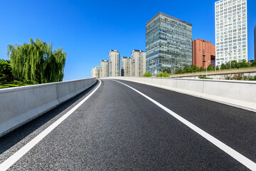 Asphalt road and modern city commercial buildings in Beijing,China.