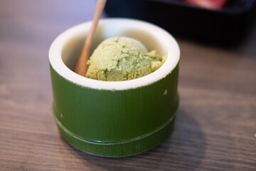Japanese green tea ice cream in bamboo bowl