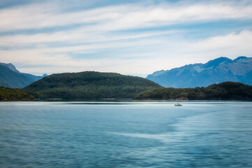 Close up on a motorboat on a beautiful afternoon on the lake at Te Anau in Fiordland National Park, New Zealand, South Island.