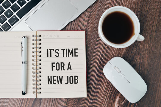 Klang,Malaysia: 25th January 2021-Top view of laptop, a cup of coffee, computer mouse, pen and notebook written with text IT'S TIME FOR A NEW JOB.