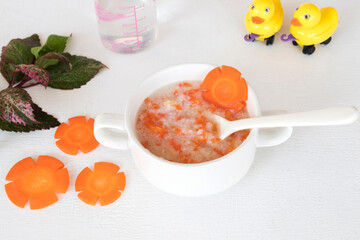 mix rice gruel and carrot healthy foods health care for baby eats breakfast with duck toy...