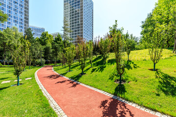 Quiet city park and modern commercial buildings.