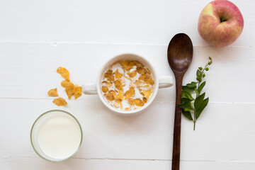 mix corn flakes, milk healthy foods for children eats and healthy drinks fresh milks in breakfast arrangement flat lay style on background wooden white