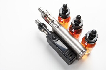 Vape pen next to smoking oils. Devices for smoking electronic cigarettes. Vape pen designed for...