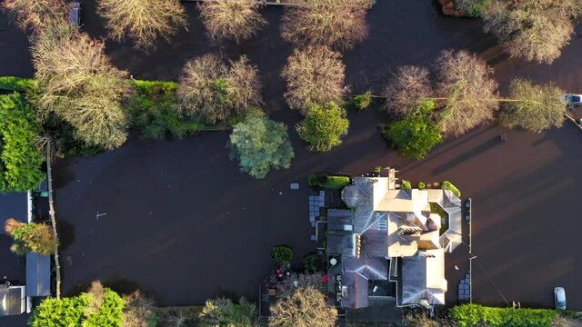 Top down drone shot of flooded roads and houses in cheshire due to storm christoph.