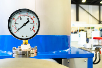 Pressure sensor on industrial equipment. Concept - pressure control in pipes. Pressure sensor on gas pipes. Gas equipment. Fragment of equipment at an industrial enterprise. Mechanical brush close up