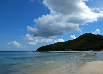 Fototapeta na wymiar Natural landscape of Blue ocean sea and white sand beach with cloud blue sky