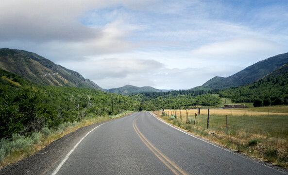 Cloudy sky with the road on a warm summer day in the Uinta National Forest in Utah