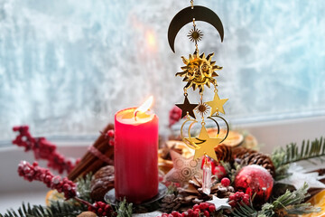 Wiccan Solstice symbol and candle, winter decor. Witchcraft Ritual, energy healing minerals. Esoteric, relax, life balance concept. Yule, Magical Winter Solstice