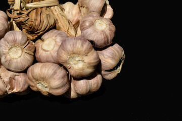 Isolated garlic on black background with copy space