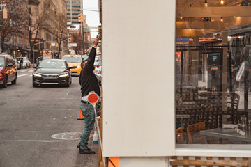 Restaurant sidewalk set up patio during pandemic
