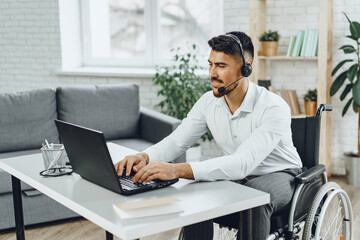 Disabled young man businessman working from home