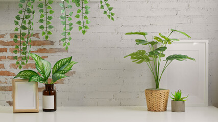 Biophilia workspace interior design with houseplant, mock up frame and copy space