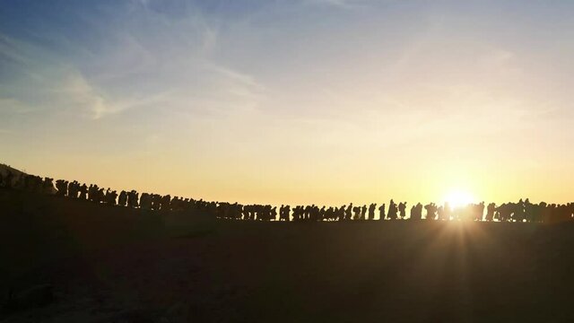 The Jews being expelled and going into exile all over the world in the Middle Ages., silhouette of Israelis walking in the sunset