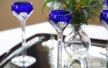 Blue glass of alcoholic drink on the table
