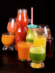 fruit and vegetable juices on a dark background