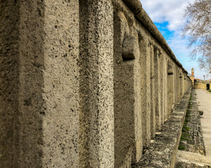 Long stone row road with perspective. Clear sky and hiking. Geometric repetitions.