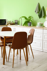 Dinning table in interior of modern kitchen