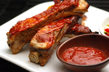 Barbecue pork ribs grilled on a white plate