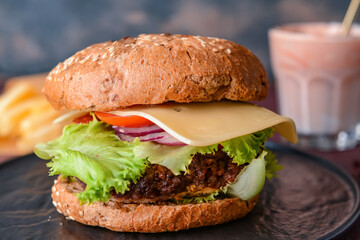 Tray with tasty burger on table