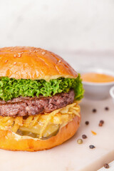 Tasty burger on light background, closeup