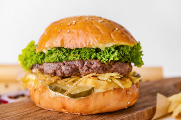 Board with tasty burger on white background