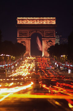 Triumphal arch in a city at night, Arc De Triomphe, Paris, Ile-de-France, France