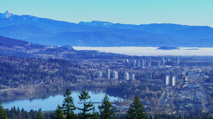 Port Moody, BD,  at Burrard Inlet with mountain and cloud inversion backdrop