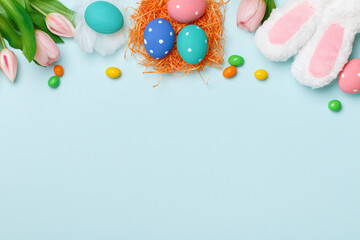 Easter composition on a blue background. Top view banner with copy space flat lay greeting card.