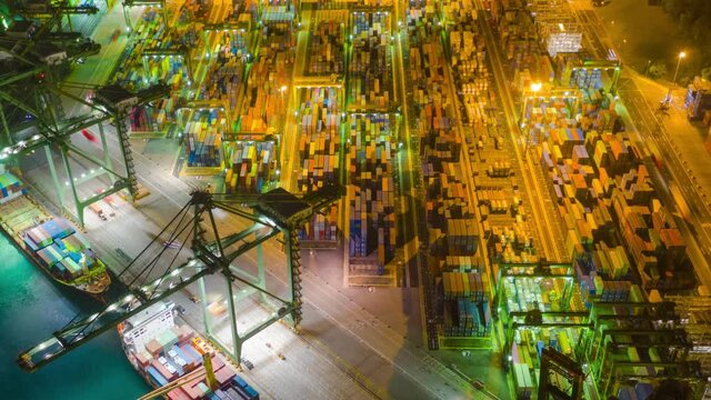 Hyper lapse 4K video, aerial view, working in the import-export port, complete with bulk cargo containers during dusk, road and water traffic.