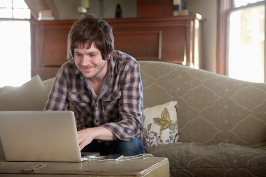 A man working from home using a laptop.