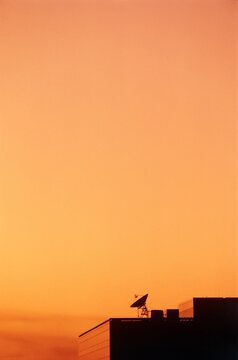Satellite on the roof of a telecom tower, Texas, USA