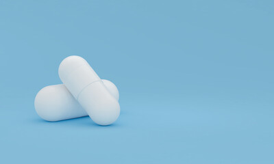 Two white pills on a blue background. Conceptual medical theme. 3D render
