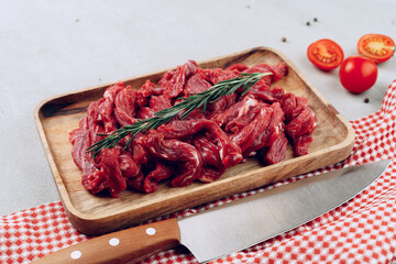 Raw beef meat fillet on wooden board