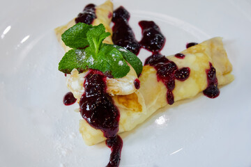 Pancake with cottage cheese and jam. Close-up, selective focus