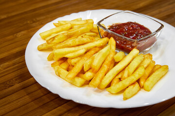 French fries with ketchup on a plate