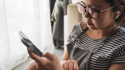 person using phone in home office