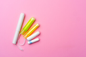 Hygienic female tampon on a pink background