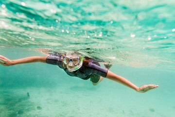 Ecuador, Galapagos Islands, Woman snorkeling in sea