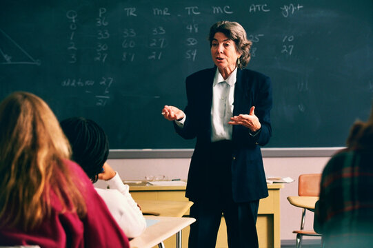 Female professor giving lecture to the university class
