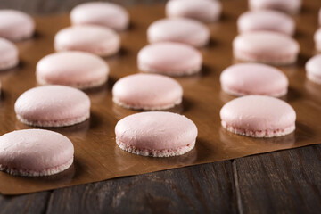 Process of making macaroons, dark background