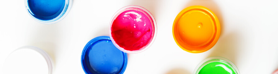 Gouache Paint cans on a white background. banner